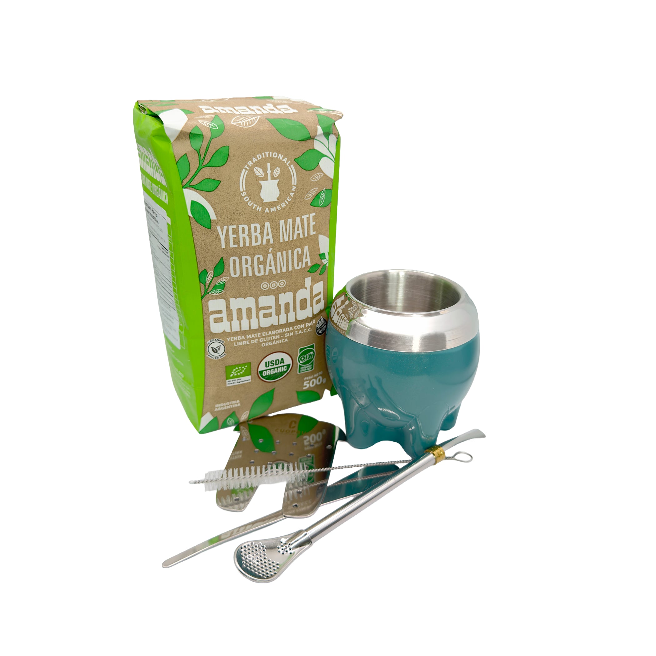 Complete Organic Master Mate Kit items spread out: 500g bag of Amanda Organic Yerba Mate, a modern lagoon-teal stainless steel Paton Mate cup, a premium gold-ring bombilla, a custom yerba separator tool, and a cleaning brush.