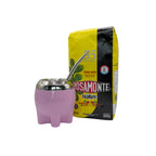 Pink modern Milonga mate cup with a stainless steel bombilla inserted, standing next to a bag of Rosamonte Suave mild yerba