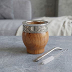 Triunfo Mate Gourd Set in solid algarrobo wood, featuring an engraved stainless steel rim, classic nickel bombilla, and cleaning brush