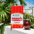 Amanda Yerba Mate Traditional 1kg package next to a traditional gourd mate cup with a bombilla in a garden.