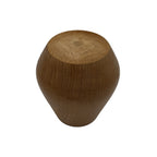 Detail of the stable base and natural wood grain of the handcrafted Carnavalito mate.