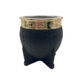 Front view of the Chacarera mate gourd featuring a textured black exterior and an ornate gold-finished stainless steel rim
