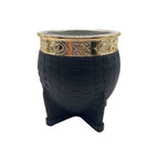 Front view of the Chacarera mate gourd featuring a textured black exterior and an ornate gold-finished stainless steel rim