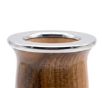 Close-up view of the polished stainless steel rim and lacquered wood grain of the Chaya mate gourd.