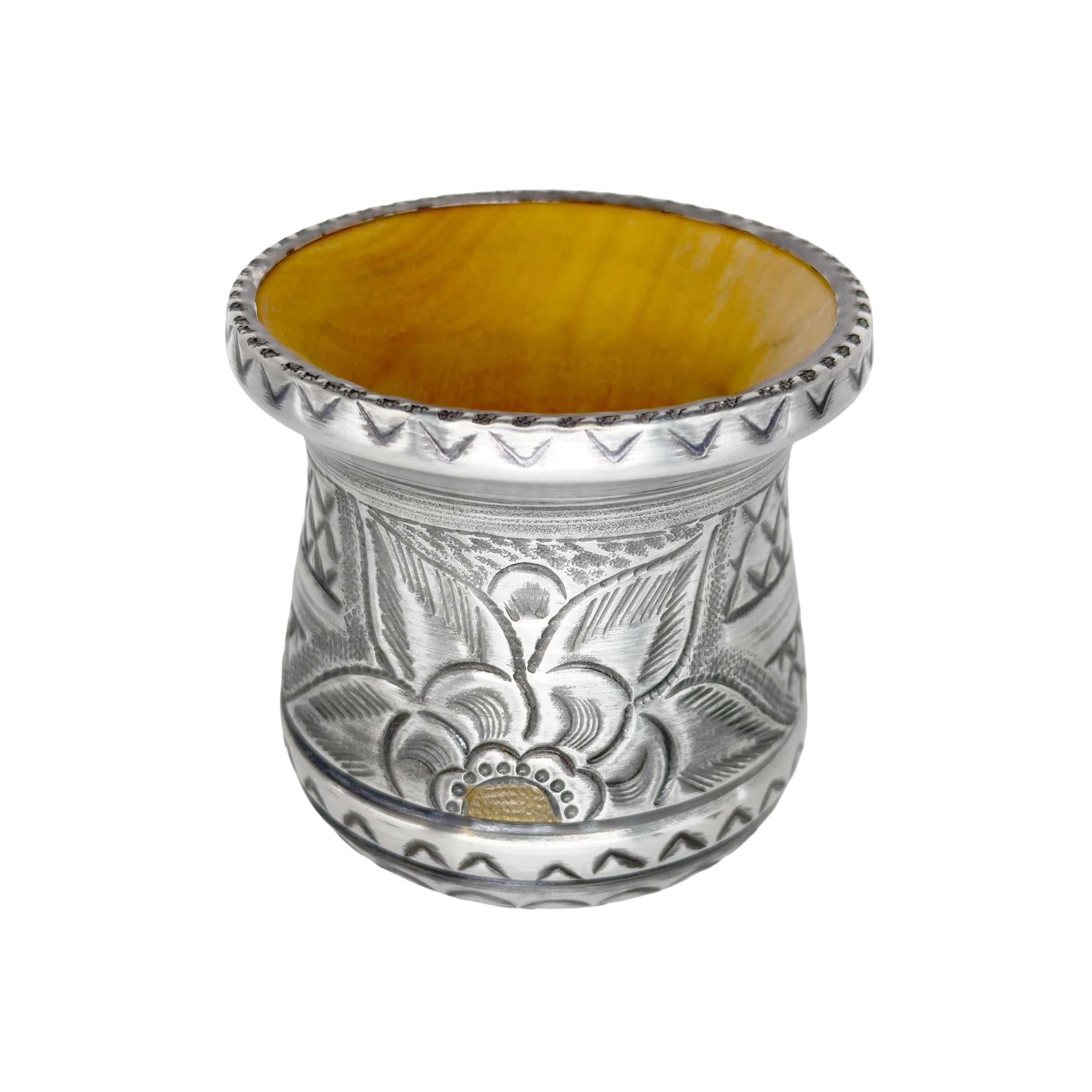 Premium handmade yerba mate cup shown from a high angle, beautifully highlighting the warm natural wood interior, the wide flared metal rim, and the intricate floral repoussé exterior.