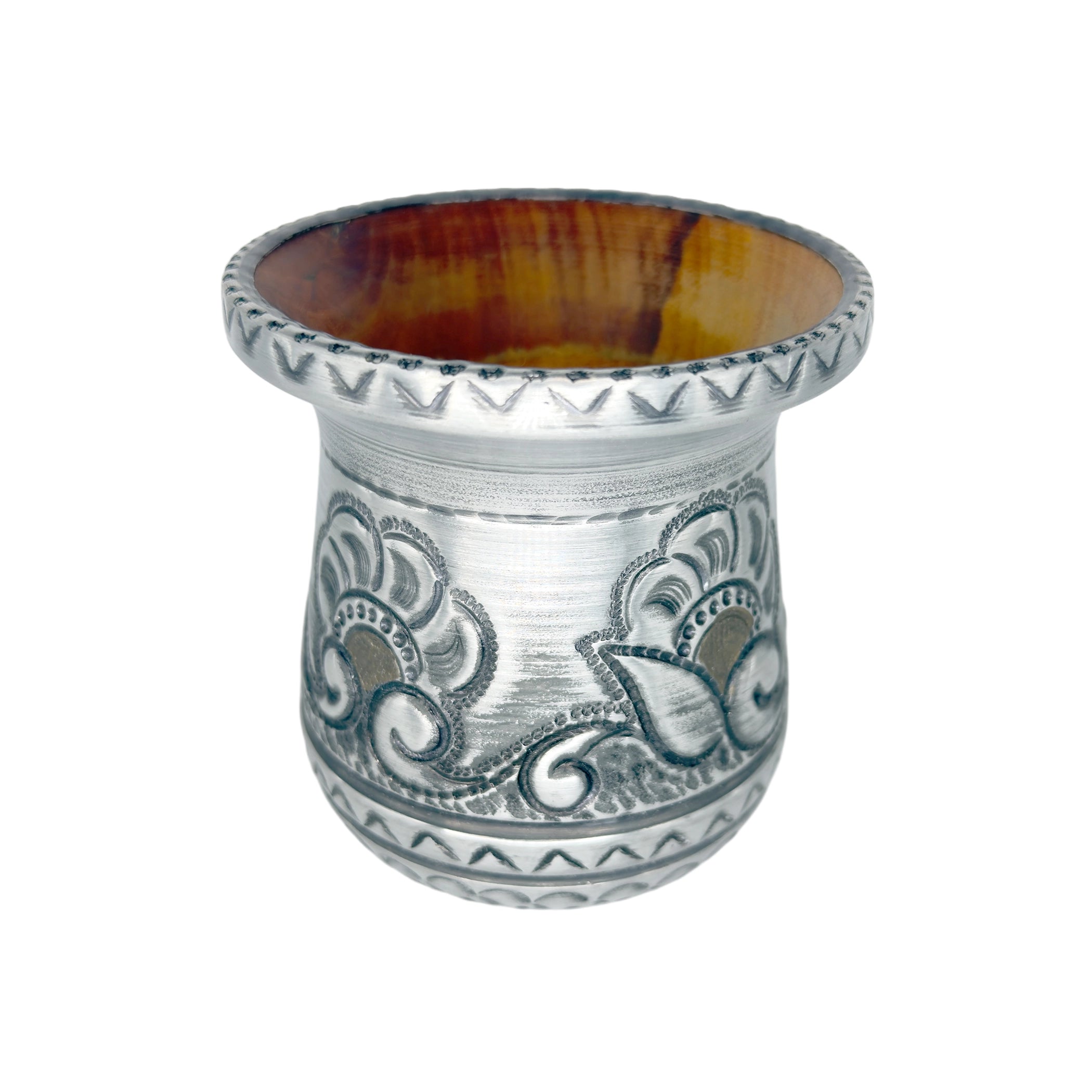 A three-quarter angle view of the premium Huella artisan gourd, revealing the rich, natural grain of its wood interior contrasting beautifully with the handcrafted floral metalwork and brass accents.