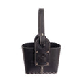A black leather matera with a single top handle, featuring white contrast hand-stitching, silver-tone hardware, and an embossed Sun of May design, set against a white background.