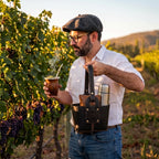 Lifestyle shot of a man enjoying a hot mate in a vineyard, carrying his thermos and accessories in a handcrafted black leather Patria Matera by Luv Mate.