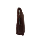 side profile view. A closed handcrafted leather yerbera in reddish-brown Alazan color stands vertically, showcasing the sturdy integrated side loop with a metal bombilla inserted and the embossed mate gourd design on the lower pocket, both for display (bombilla sold separately).