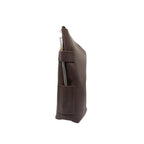 Side profile view of the handcrafted leather yerbera. This angle highlights the sturdy side pocket featuring an embossed mate gourd design, and the top zipper closure. A metal bombilla is inserted in the holder for display purposes only (bombilla sold separately).