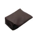 Bottom and back view of the handcrafted leather yerbera. The closed, rich brown bag is lying flat, showcasing the smooth premium leather texture and the sturdy stitched base construction.