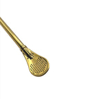 Detailed view of the perforated paddle filter on the gold Puna mate straw.