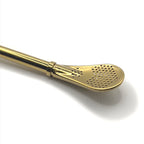 Side profile of the flat head filter on the gold-colored bombilla.