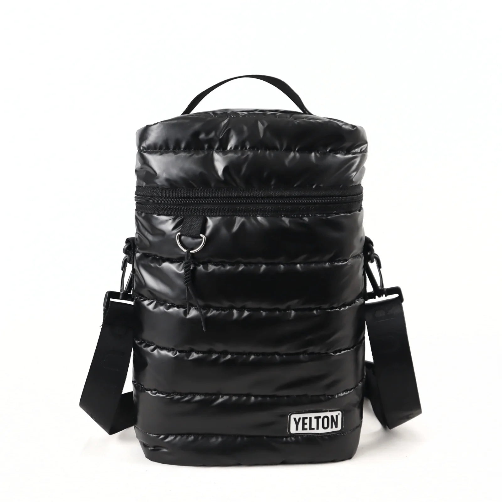 Front view of a black quilted puffer-style mate carrying bag by the brand YELTON against a plain white background. The image highlights the horizontal puff stitching, a top grab handle, a main zipper closure with a metal D-ring attachment, an adjustable black shoulder strap, and a white rectangular YELTON logo patch on the bottom right.