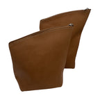 Side view of the Adobe Tan Zonda leather pouches showing the flexible travel-friendly design.